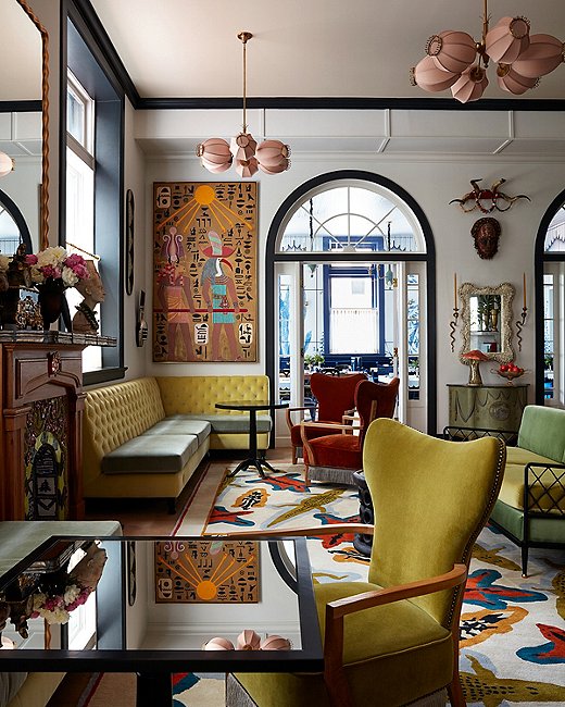 The hotel’s Living Room (above and top) plays into fantasies of living in a museum. The preponderance of golds and greens, along with the wealth of velvet, gives cohesiveness to the diversity of the art and objets.
